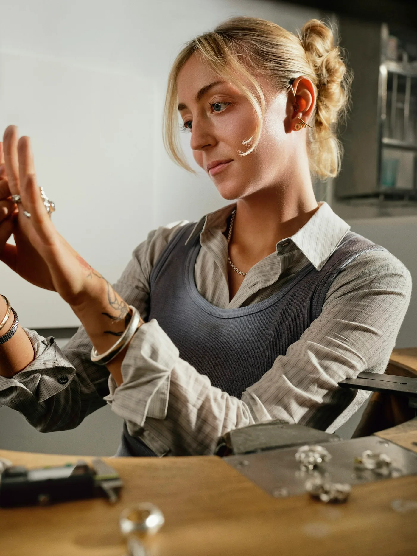A jeweller examining a ring at the workbench
